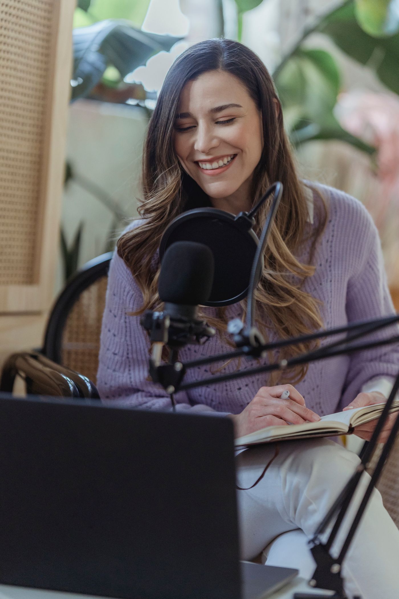 Smiling on-air host at the microphone